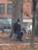 FRANK GIGLIO SITTING BENEATH A TREE IN THE DRIZZLILNG RAIN AS HIS HOUSE IS BROUGHT TO THE GROUND